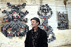 Michael Brennand-Wood in front of his finished work which is in the dye house at Standfast & Barracks in Lancaster, England.