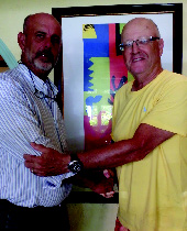 Greg Curry, owner of Cafe Matisse Restaurant, Nassau, Bahamas with Eric Schneider, Publisher