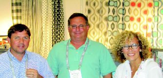 Here is Michael Hodges, Sales Manager and Steve Blumenfeld, sales representative with Premier Fabrics, the print people from Sherman near Tupelo, Mississippi with new customer Marybeth Roberts, Managing Partner of ‘Simply Cinched’, a tablecloth producer in Keyport, New Jersey.